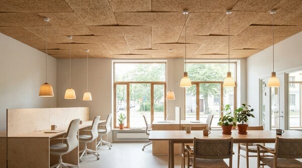 Wood wool acoustic ceiling tiles in grid pattern