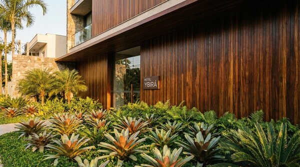 Exterior wall finished in tropical hardwood cladding boards