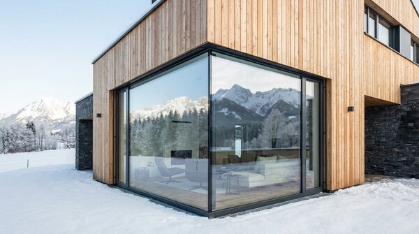 Triple glazed frameless window system on modern building